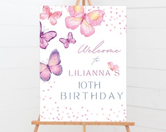 May include: Welcome to Lilianna's 10th Birthday sign with a pink and purple butterfly design and pink and gold confetti.