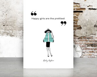 May include: A white poster with the quote "Happy girls are the prettiest" and a black and teal illustration of a woman carrying teal boxes. The quote is in black, with the author's name, Audrey Hepburn, below the illustration.