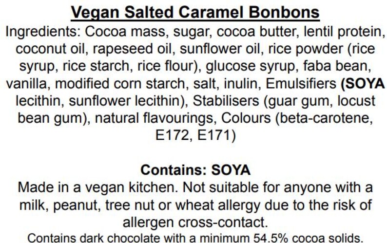 May include: A product label for Vegan Salted Caramel Bonbons listing ingredients including cocoa mass, sugar, cocoa butter, lentil protein, coconut oil, rapeseed oil, sunflower oil, rice powder, glucose syrup, faba bean, vanilla, starch, salt, and soya.