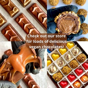 May include: Assortment of vegan chocolates in various shapes and flavours, including caramel, chocolate, and nut-filled.  The text "Check out our store for loads of delicious vegan chocolates!" is displayed on the image.