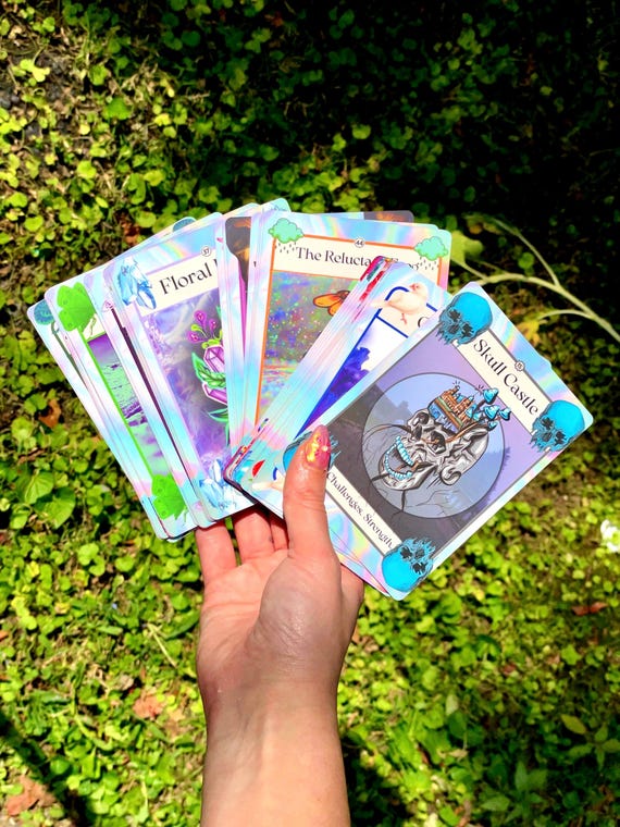 holographic oracle cards Lenticular Tarot and Decks: A Labor of Love minimalist tarot deck featuring intricate hand drawn images and simple holographic back. Moonlight Tarot Deck: Silver Foil,