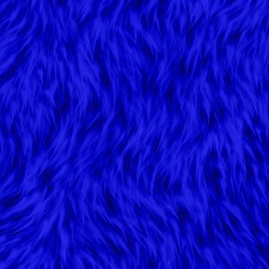 May include: A close-up of a vibrant blue faux fur fabric. The texture is dense with long, flowing fibers, creating a soft, plush appearance. The color is a deep, saturated blue, with subtle variations in tone.