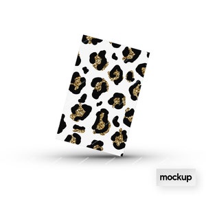May include: A white background with a black and gold leopard print pattern. The print is made up of black leopard spots with gold glitter accents.