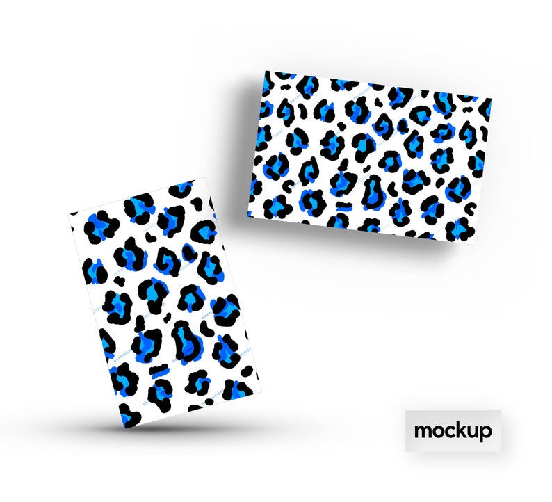 May include: Two mockups of a business card with a blue and black leopard print design. The text "mockup" is printed on a white background.