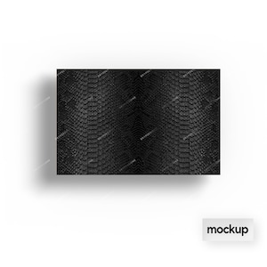 May include: Black and white snakeskin pattern. The pattern is a close-up of a snakeskin texture.