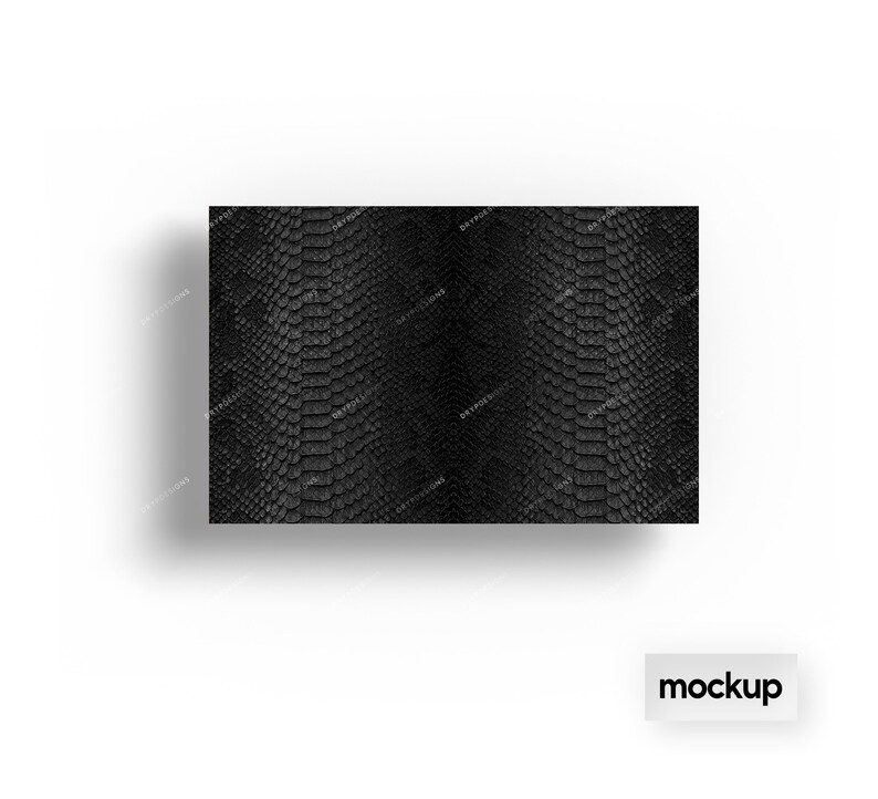 May include: Black and white snakeskin pattern. The pattern is a close-up of a snakeskin texture.