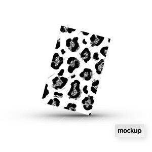 May include: A white background with a black and silver leopard print pattern. The pattern is a repeating design of leopard spots with a silver glitter effect.