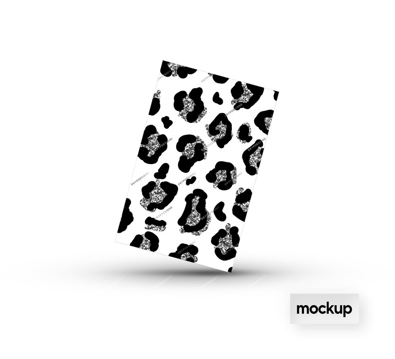 May include: A white background with a black and silver leopard print pattern. The pattern is a repeating design of leopard spots with a silver glitter effect.
