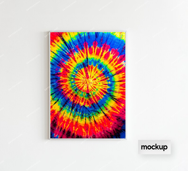 May include: A framed print of a colorful tie-dye pattern in shades of red, yellow, blue, and green. The pattern is a circular design with a white center.