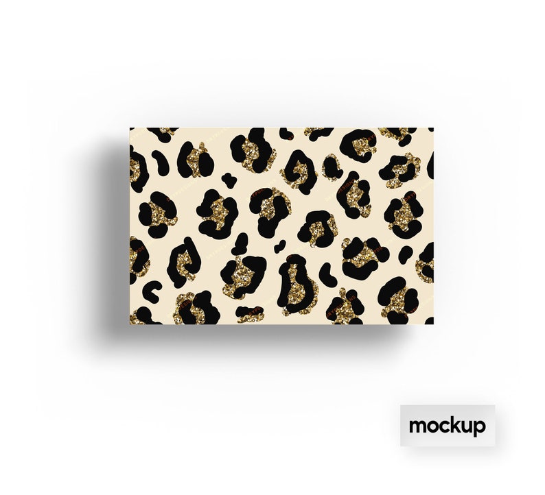 May include: A beige background with a repeating pattern of black leopard spots with gold glitter accents.