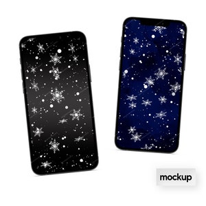 May include: Mockup of two smartphone screens displaying a wintery design with white snowflakes on a dark blue and black background.