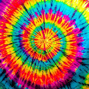 May include: A colorful tie-dye pattern in shades of red, yellow, blue, and green. The pattern is a spiral design with a central point.