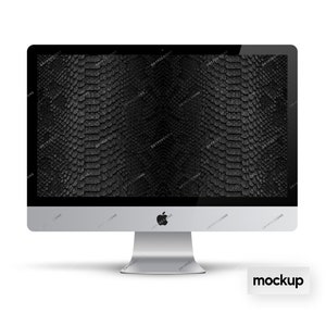 May include: A silver desktop computer with a black screen displaying a snake skin pattern. The computer is on a white surface with the word "mockup" printed below it.