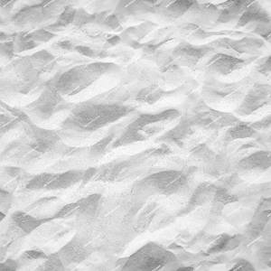 May include: Close-up of white sand with a textured, rippled surface. The sand is soft and fine, creating a natural, organic background.
