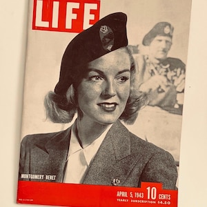 May include: Vintage LIFE magazine cover featuring a woman in a dark beret and gray blazer. The cover text reads "LIFE" in large red letters. Additional text includes "MONTGOMERY BERET" and "APRIL 5, 1943 10 CENTS".