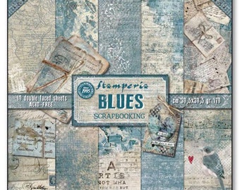 May include: A pack of 10 double-sided scrapbooking paper sheets with a blue and white color scheme. The paper features a variety of vintage-inspired designs, including maps, music notes, and floral patterns. The pack is labeled "Stamperia Blues Scrapbooking" and includes the text "Art is not what you see but what you feel".
