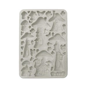 May include: A light gray silicone mold featuring various fairy house and mushroom designs. The mold includes detailed mushroom houses, toadstools, butterflies, and acorns, perfect for crafting decorative elements. The overall theme is whimsical and fantasy-inspired.