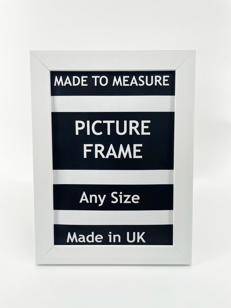May include: White picture frame with black and white stripes and the text "MADE TO MEASURE PICTURE FRAME Any Size Made in UK"