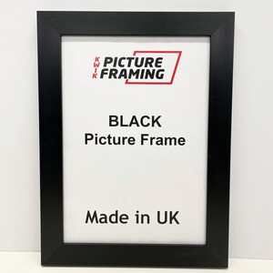 May include: Black picture frame with the text "KWIK PICTURE FRAMING" and "BLACK Picture Frame" and "Made in UK".