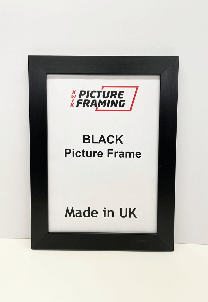 May include: Black picture frame with the text "KWIK PICTURE FRAMING" and "BLACK Picture Frame" and "Made in UK".