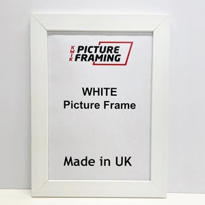 May include: White picture frame with the text "KWIK PICTURE FRAMING" and "WHITE Picture Frame Made in UK" printed on it.
