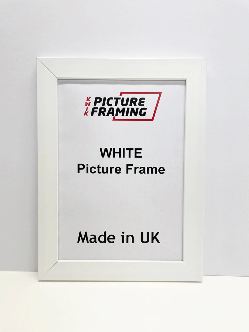 May include: White picture frame with the text "KWIK PICTURE FRAMING" and "WHITE Picture Frame Made in UK" printed on it.
