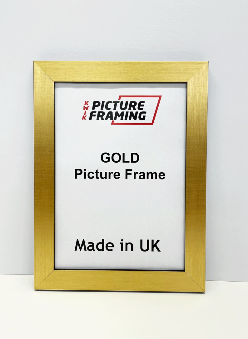 May include: Gold picture frame with a white mat and the text "Kwik Picture Framing" and "Gold Picture Frame" and "Made in UK".
