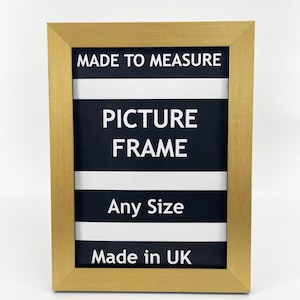 May include: Gold picture frame with black and white stripes and the text "Made to Measure Picture Frame Any Size Made in UK".