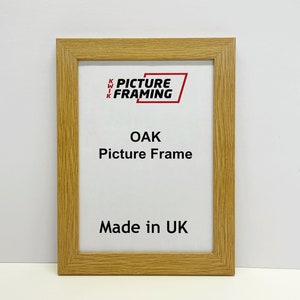 May include: A natural oak picture frame with the text "Kwik Picture Framing" and "Oak Picture Frame" in red. The frame also says "Made in UK".