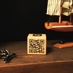 a wooden block with a qr code on it