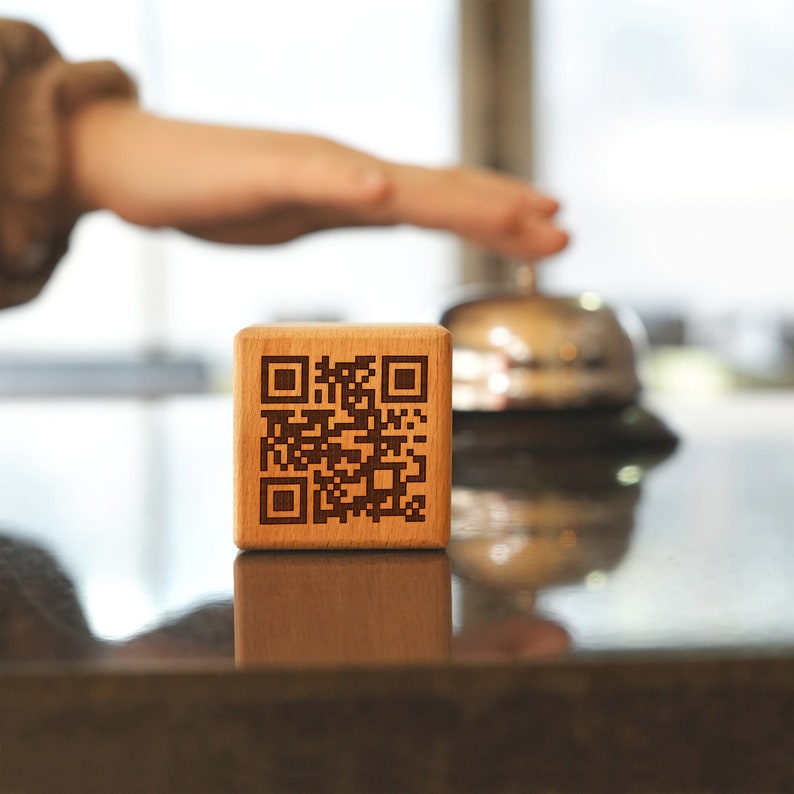 a wooden block with a qr code on it