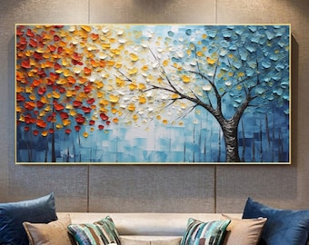 May include: Abstract painting of a tree with colorful leaves in shades of red, orange, yellow, and blue. The tree is painted in a textured style, with thick brushstrokes and visible paint.