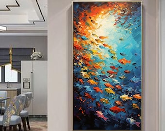 May include: A colorful abstract painting of a school of fish swimming in a blue ocean. The fish are painted in shades of orange, yellow, red, and blue. The painting has a textured, brushstroke effect.