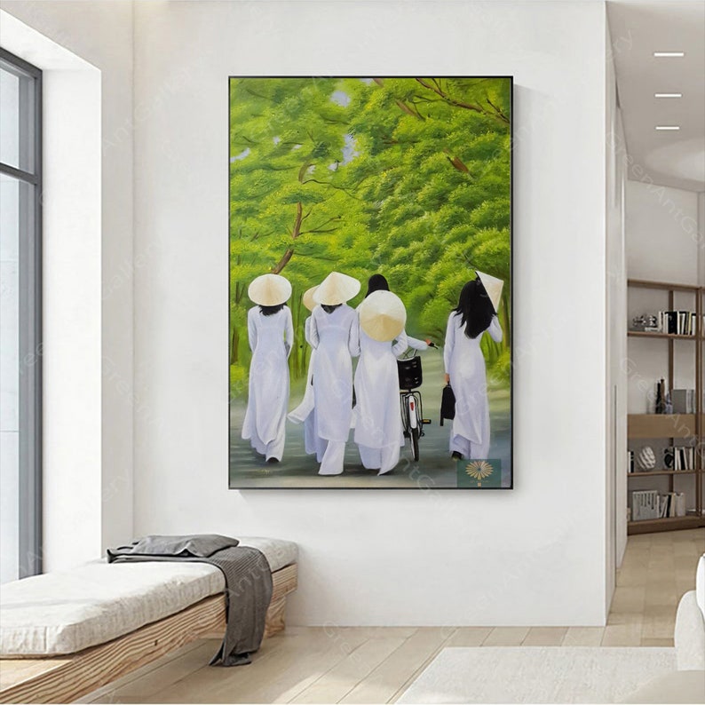 May include: A painting of four women wearing white ao dai dresses and conical hats walking down a path lined with green trees. One woman is riding a bicycle.