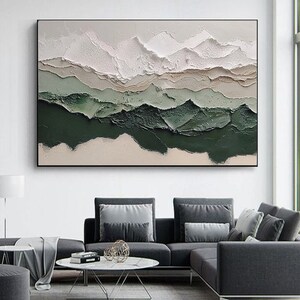 May include: Abstract painting with a textured, layered design. The painting features shades of white, beige, and green, creating a landscape-like effect.