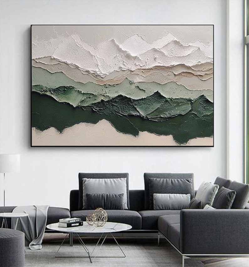 May include: Abstract painting with a textured, layered design. The painting features shades of white, beige, and green, creating a landscape-like effect.