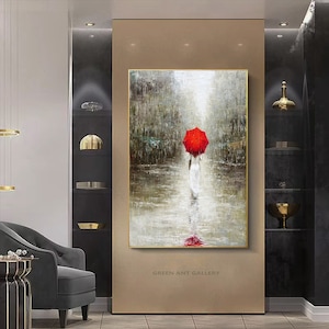 May include: A painting of a person walking in the rain with a red umbrella. The painting is done in a realistic style with a focus on the person and the umbrella. The background is a blurry cityscape with a light source in the distance.