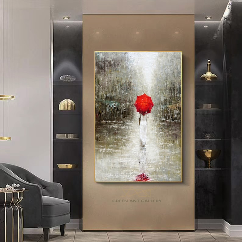 May include: A painting of a person walking in the rain with a red umbrella. The painting is done in a realistic style with a focus on the person and the umbrella. The background is a blurry cityscape with a light source in the distance.