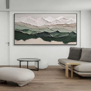 May include: Abstract painting with a textured, layered design. The painting features shades of white, beige, and green, creating a landscape-like effect.