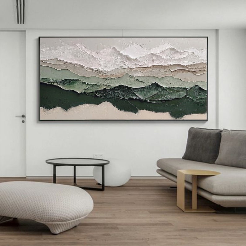 May include: Abstract painting with a textured, layered design. The painting features shades of white, beige, and green, creating a landscape-like effect.