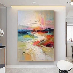 May include: Abstract landscape painting with a gold frame. The artwork features a textured surface with a palette of colors including blue, orange, pink, and yellow. The brushstrokes create a sense of depth and movement, evoking a serene atmosphere.