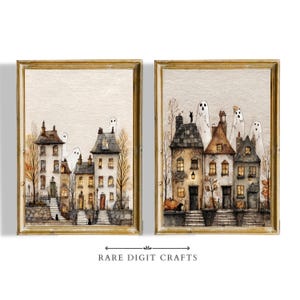 May include: Two framed watercolour prints depicting Halloween townhouses with ghosts and pumpkins. The artwork features detailed architectural elements, warm lighting, and autumn foliage. The text "RARE DIGIT CRAFTS" is at the bottom.