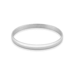 May include: A silver-colored bangle bracelet with a flat, beveled design. The bracelet is a solid band of metal, reflecting light. The jewelry is simple and elegant, suitable for everyday wear.
