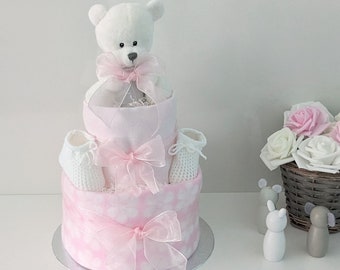 Teddybeer luiertaart. Roze en witte babyshowercadeau of middelpunt. Nieuw babymeisje cadeau. Het is een meisjescadeau