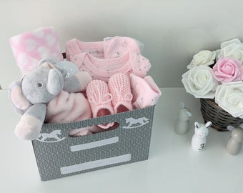 Pink elephant baby gift with 5-piece elephant print layette set, elephant comforter, pink fleece wrap and booties