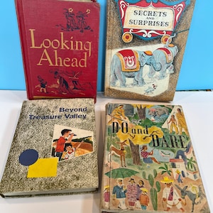 May include: Four vintage children's books with colorful covers. The titles are "Looking Ahead", "Secrets and Surprises", "Beyond Treasure Valley", and "Do and Dare".