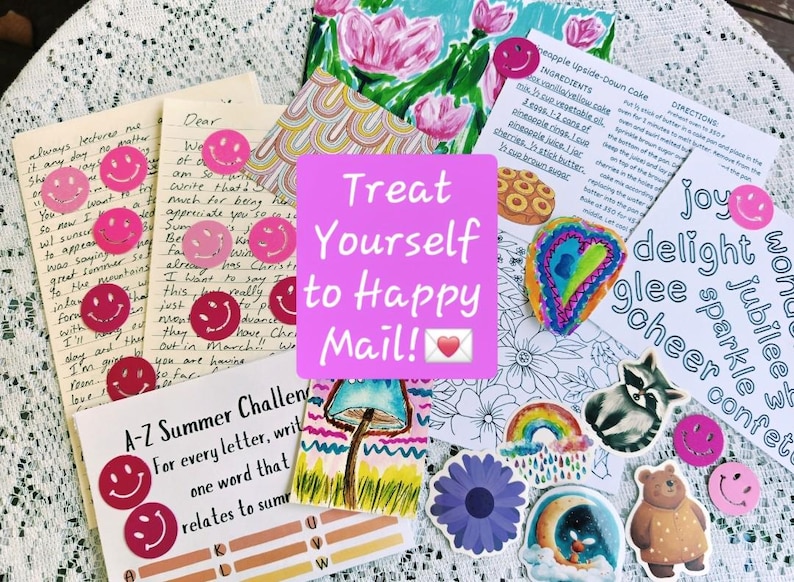 May include: A collection of stationery items including handwritten letters, a recipe card for pineapple upside-down cake, an A-Z summer challenge sheet, and various stickers featuring a raccoon, bear, rainbow, flowers, and pink smiley faces.