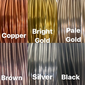 May include: Six spools of wire in different colors: copper, bright gold, pale gold, brown, silver, and black.