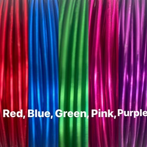 May include: Five spools of metallic thread in red, blue, green, pink, and purple. The spools are arranged side-by-side and the text "Red, Blue, Green, Pink, Purple" is printed below the spools.