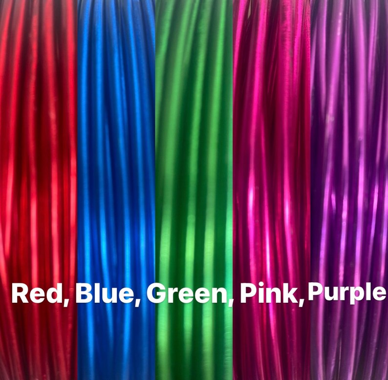 May include: Five spools of metallic thread in red, blue, green, pink, and purple. The spools are arranged side-by-side and the text "Red, Blue, Green, Pink, Purple" is printed below the spools.